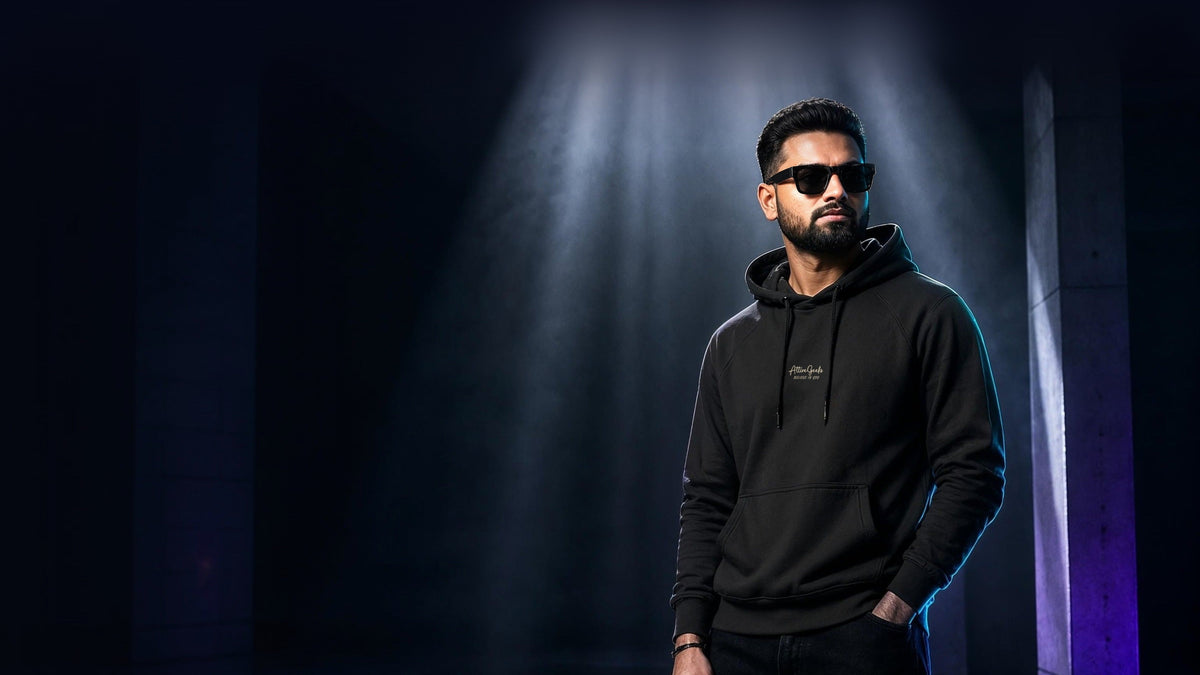 AttireGeeks black hoodie under spotlight